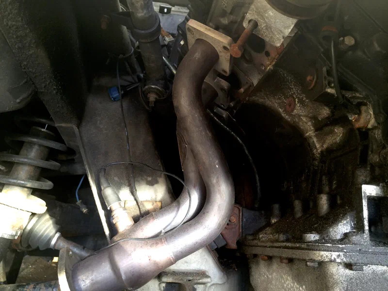 Exhaust Header and Oil Dipstick
