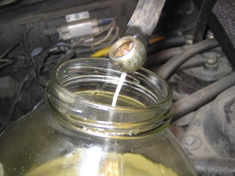 Draining gas from the fuel lines; it should be clear, not foggy.