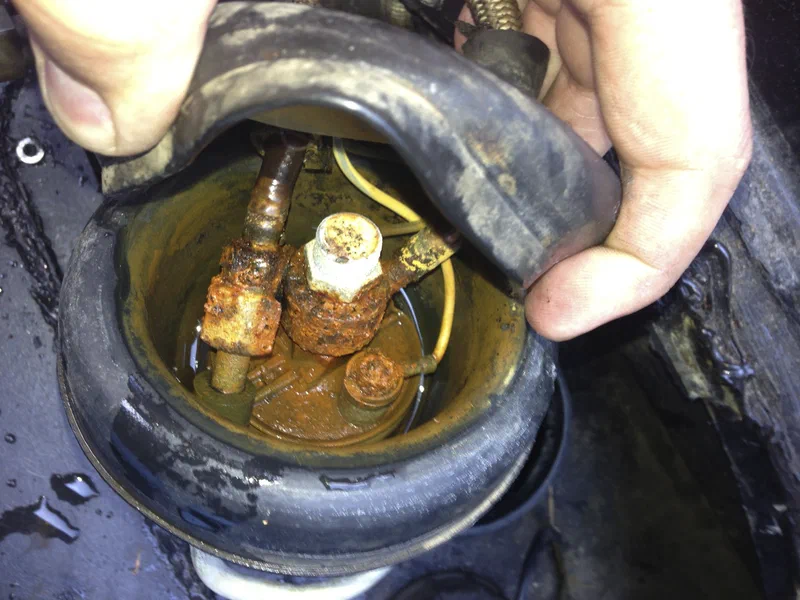 Top of the fuel pump, rusted and drained of water
