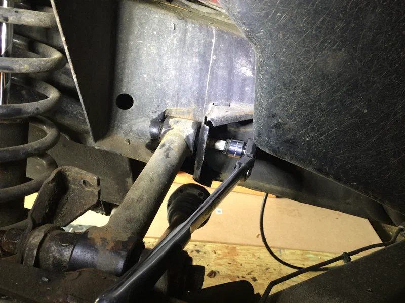 Removing Upper Link Arm Bolt (Frame)