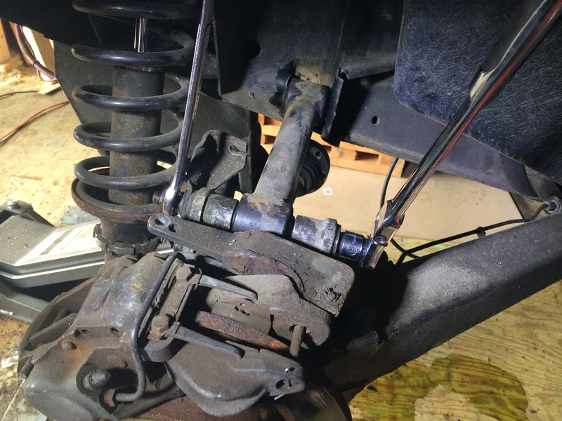 Removing the Upper Link Arm Bolt (Hub Carrier)